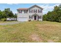 Two-story home with traditional exterior and integrated garage, set on spacious lot at 3401 Shillinglaw Rd, Sharon, SC 29742