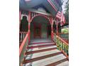 Inviting front porch with detailed woodwork and stairs leading to the entrance at 425 W Horah St, Salisbury, NC 28144