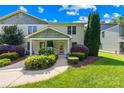 Beautiful townhouse with a covered entrance, mature landscaping, and a well-maintained lawn at 49009 Dockside Ln # D, Albemarle, NC 28001