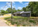Attractive one-story house with gray siding, lush green lawn, and a welcoming entrance at 627 West Main Ext, Lincolnton, NC 28092
