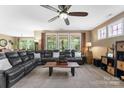 Bright living room featuring neutral paint, a ceiling fan, and natural light at 708 Ardent Trl, Belmont, NC 28012