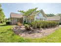 This property features a backyard with plush green grass and manicured landscaping at 8183 Sultana Cir, Charlotte, NC 28227