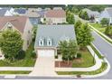 Aerial view of a well-kept home with a two-car garage, lush landscaping, and a charming neighborhood at 867 Pecan Tree Ln, Fort Mill, SC 29715