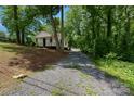 Charming house nestled in trees with a long gravel driveway at 905 Gantt St, Kings Mountain, NC 28086