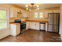 Bright kitchen featuring modern stainless steel appliances, wooden countertops, and ample storage space at 905 Gantt St, Kings Mountain, NC 28086