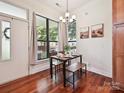 Cozy dining area bathed in light, features hardwood floors and stylish decor at 956 Warren Burgess Ln, Charlotte, NC 28205