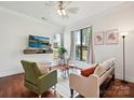 Bright living room featuring hardwood floors, neutral walls and modern furnishings at 956 Warren Burgess Ln, Charlotte, NC 28205