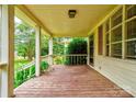 Inviting covered front porch with wood flooring and white railings at 105 Hopewell Church Rd, Shelby, NC 28152