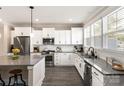 Modern kitchen featuring stainless steel appliances, gray countertops, white cabinetry and subway tile backsplash at 1100 Herrons Ferry Rd, Rock Hill, SC 29730