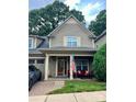 Inviting exterior showcases a well-maintained home with a welcoming front porch and manicured lawn at 128 Aztec Cir, Mooresville, NC 28117
