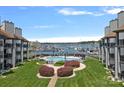 Exterior view of a refreshing pool and marina view, nestled between the condominiums at 18853 Vineyard Point Ln, Cornelius, NC 28031