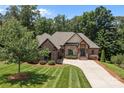 Attractive brick home with lush lawn and mature trees in desirable neighborhood at 2341 Shiny Leaf Dr, Denver, NC 28037