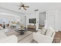 Open-concept living space featuring modern design, hardwood floors, and ample natural light at 3153 Bending Birch Pl, Charlotte, NC 28206