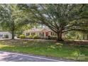 Inviting home with a well-manicured lawn and mature trees, situated on a quiet street at 3595 Mt Holly Rd, Edgemoor, SC 29712