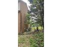 This yard features a mix of brick, and utility elements, enclosed by greenery and trees at 4227 Kiser Woods Sw Dr, Concord, NC 28025
