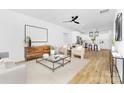 Bright, open-concept living room with sleek furnishings, neutral tones, and lots of natural light at 428 Clay St, Mooresville, NC 28115