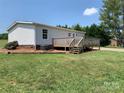 Lovely deck that offers a tranquil space, complemented by the lush greenery of the surrounding landscape at 6219 Heavner Rd, Vale, NC 28168