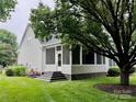 The home features a screened porch, new stairs, and a well-maintained lawn with mature trees at 6632 Hawksnest Dr, Charlotte, NC 28269