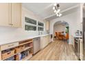 Well-lit kitchen with neutral cabinets, stainless steel appliances, and wood flooring at 747 Saint Michaels Ln # 7, Gastonia, NC 28052