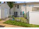 A cozy backyard with a patio area, partially fenced for privacy and gardening at 7881 Mariners Pointe Cir, Denver, NC 28037