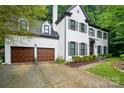 Beautiful two-story home featuring a two-car attached garage and manicured landscaping at 8708 Piccone Brook Ln, Charlotte, NC 28216