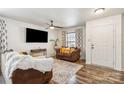 Cozy living room has a ceiling fan and is furnished with brown leather sofa and attractive window coverings at 925 Skywatch Ln, Monroe, NC 28112
