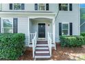 A close-up of the home's front door shows the entrance and surrounding exterior details at 9513 Saddle Run Trl, Charlotte, NC 28269