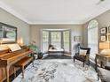 Bright living room with a bay window, neutral colors, and comfortable seating arrangement at 105 Beech Bluff Dr, Mount Holly, NC 28120