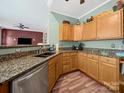 Kitchen with oak cabinets and stainless steel appliances at 11909 Creek Turn Dr, Charlotte, NC 28278