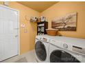 Functional laundry room with modern washer and dryer set at 11909 Creek Turn Dr, Charlotte, NC 28278