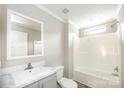Bright bathroom featuring a shower and tub combination with a modern sink and mirror at 122 River Ridge Ln, Hickory, NC 28601
