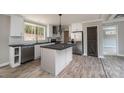 Well-lit kitchen featuring an island, stainless steel appliances, and modern fixtures at 122 River Ridge Ln, Hickory, NC 28601