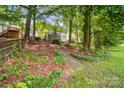 Wooded backyard featuring mature trees and privacy at 12712 Hollyhock Ln, Huntersville, NC 28078