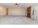 Large living room with neutral carpet and a cozy brick fireplace at 137 Citation Dr, Mooresville, NC 28117