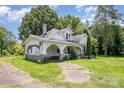 Quaint two-story home with covered porch and mature trees on an expansive lot at 1637 N College Ave, Newton, NC 28658