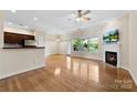 Bright living room boasts a fireplace, lots of natural light, and hardwood flooring at 2765 Clover Nw Rd, Concord, NC 28027
