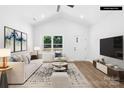 Bright living room with high ceilings, sleek wood floors, and stylish contemporary furniture at 332 Hollingswood Dr, Statesville, NC 28625