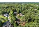 Discover a charming neighborhood surrounded by lush greenery and mature trees in this serene aerial shot at 5310 Addington Ct, Charlotte, NC 28277