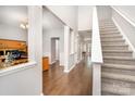 Inviting foyer with hardwood floors, columns, stairs, and lots of natural light at 5723 Lindley Crescent Dr, Indian Trail, NC 28079