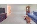 Cozy living room with neutral carpet and ample space at 6416 Wilgrove Mint Hill Rd, Mint Hill, NC 28227