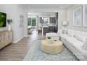 Open concept living room featuring stylish decor, modern furniture, and lots of natural light at 11034 Engelmann Ln, Charlotte, NC 28269