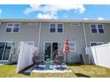 This home has a private backyard with patio chairs and privacy fence at 11034 Engelmann Ln, Charlotte, NC 28269