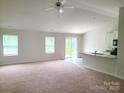 A spacious living area brightened by natural light, highlighting its open layout and welcoming atmosphere at 1195 Winding Creek Rd, Salisbury, NC 28146
