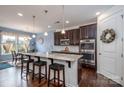 Modern kitchen with granite countertops, stainless steel appliances, and pendant lighting at 132 Hillston Ln, Mooresville, NC 28115