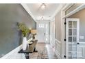 Inviting entryway with a wooden table, vase, and a view of the front door and a glass-paneled door at 1432 Ardmore Dr # 341, Sherrills Ford, NC 28673