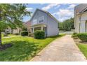 A well-kept home is showcased with its lush green lawn and concrete driveway at 1825 Stroud Park Ct, Charlotte, NC 28206