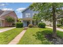Charming two-story home featuring a cozy front porch and well-maintained landscaping at 1825 Stroud Park Ct, Charlotte, NC 28206