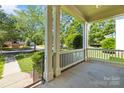 Covered front porch featuring white railings and support columns at 187 Water Oak Dr, Mooresville, NC 28117