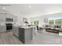 Bright, open-concept kitchen featuring an island, modern appliances, and seamless living area at 239 Paige Rd, Kings Mountain, NC 28086