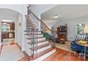 Elegant foyer with hardwood floors and staircase adjacent to the living room at 2541 Penngate Dr, Sherrills Ford, NC 28673